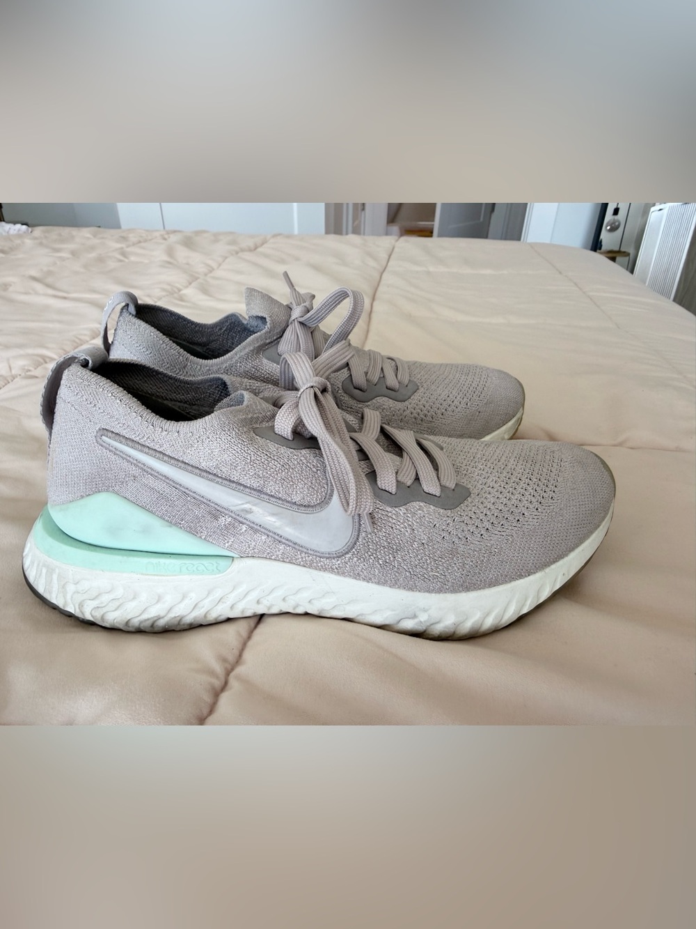 Nike Women’s Light Gray Running Shoes with Mint Heel Accent